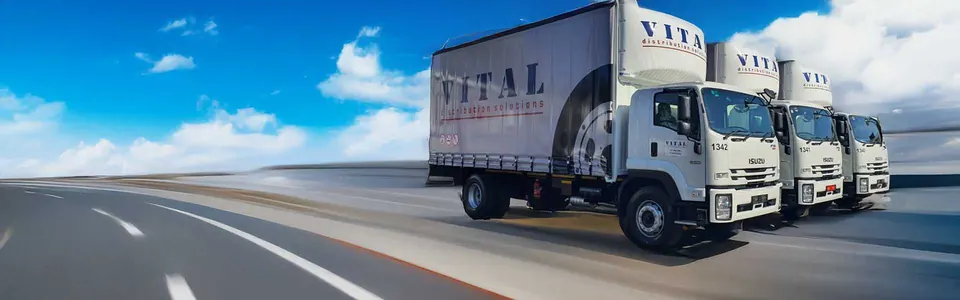 A convoy of Vital trucks on the highway
