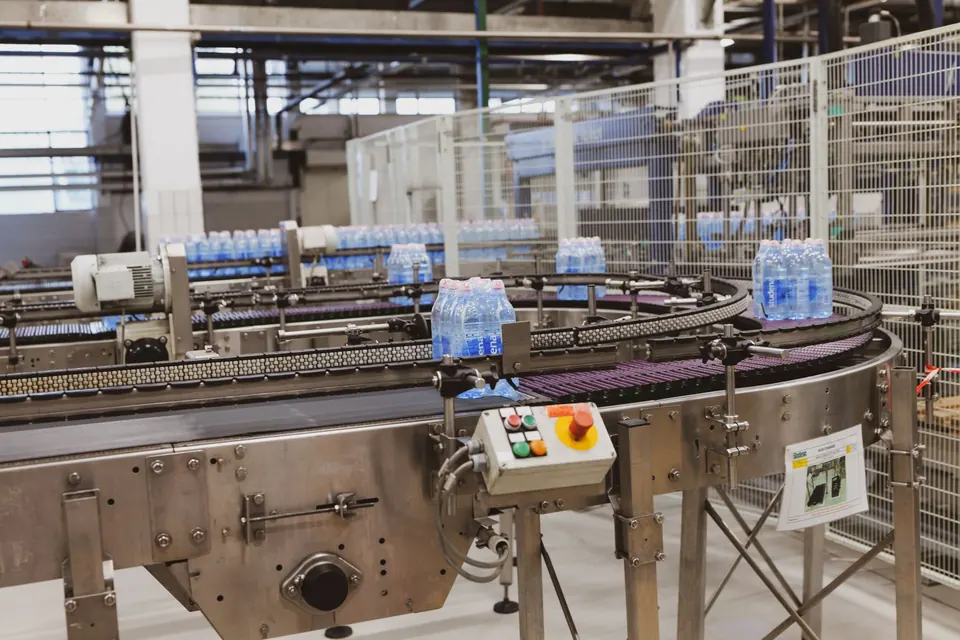 Bottled water moving along a factory conveyor