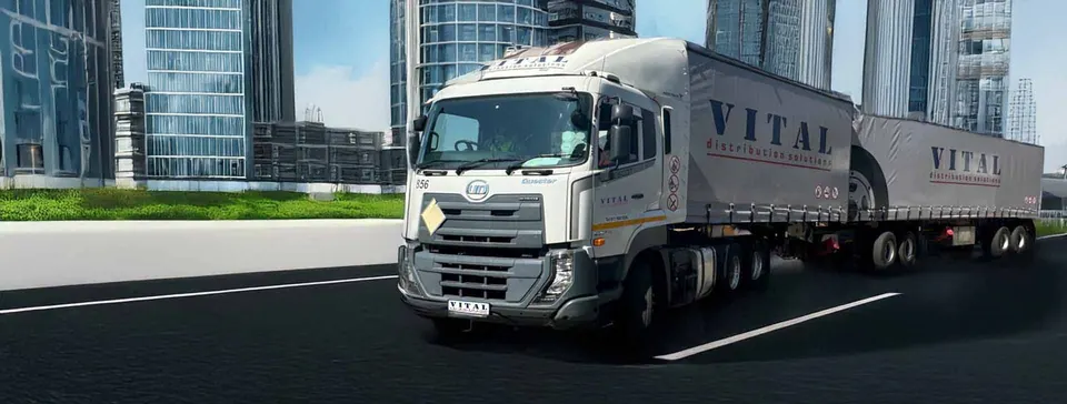 Vital superlink driving through a city business district